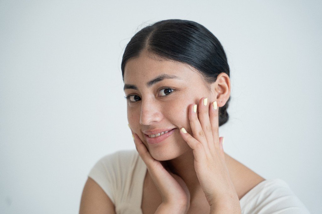 Woman smiling after skincare